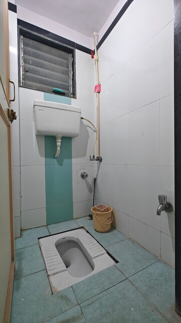 Bathroom in 2 BHK Apartment at Abhinandan CHS, Borivali West – for Rent