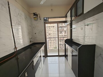 Kitchen in 1 BHK Apartment at Om Prabhu Manohar CHS, Seawoods Sector 50 – for Rent