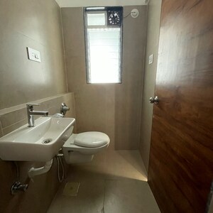 Bathroom in 1 BHK Apartment at Je And Vee Om Trimurti, Dindoshi – for Sale