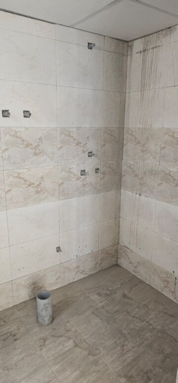 Bathroom in 3 BHK Apartment at Charms Castle, Raj Nagar Extension – for Sale