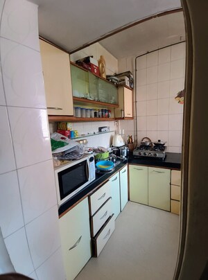 Kitchen in 2 BHK Apartment at Highland Annex, Majiwada – for Sale