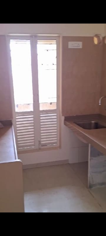 Kitchen in 2 BHK Apartment at Dosti West County, Balkum Pada – for Rent