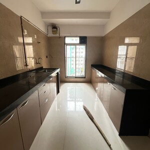 Kitchen in 2 BHK Apartment at Kaustubh Sun Moon CHS Ltd Bldg 12, Datta Pada – for Sale