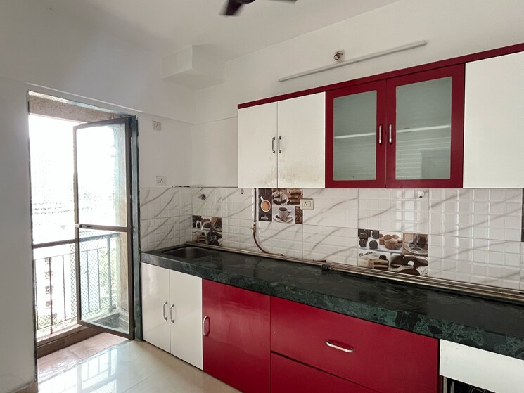 Kitchen, man-opus 2 Bedroom 670 Sq.Ft. Apartment In Miragaon Thane 8692757