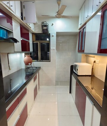 Kitchen in 3 BHK Apartment at Neelkanth Greens, Manpada – for Rent