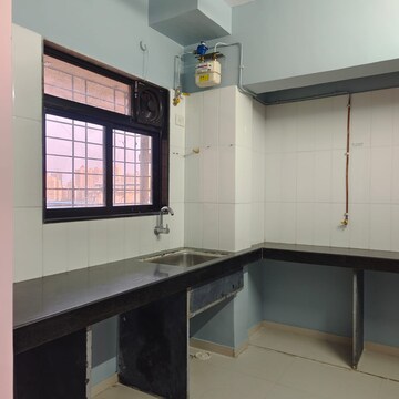 Kitchen in 1 BHK Apartment at Raunak Unnathi Woods Phase 6, Kasarvadavali – for Rent