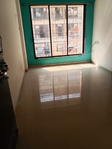 Living Room in 1 BHK Apartment at Maad Yashwant Pride-Kini Complex, Naigaon East – for Rent