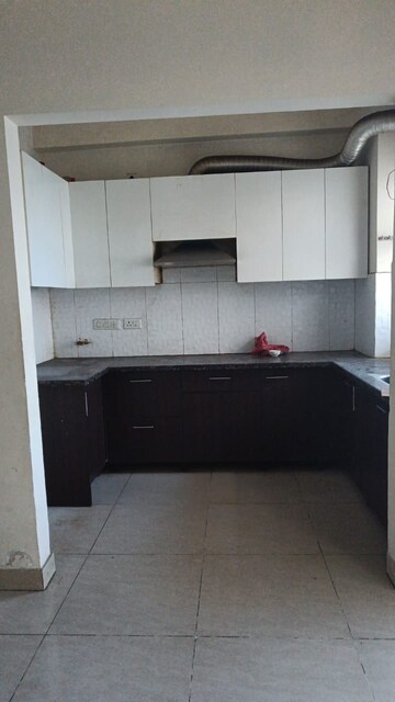 Kitchen in 2 BHK Apartment at Mahagun Mywoods, Sector 16c Greater Noida – for Rent