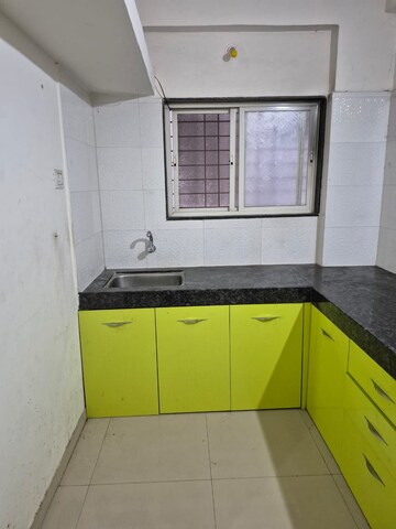Kitchen in 2 BHK Apartment at Wadgaon Sheri – for Rent