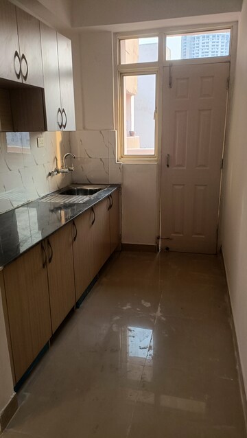 Kitchen in 2 BHK Apartment at Supertech Cape Town, Sector 74 – for Rent