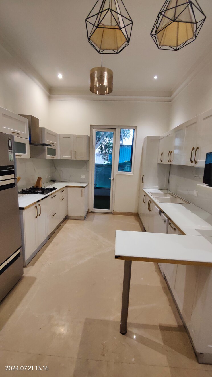 Kitchen, t-and-t-eutopia-phase-1 4 Bedroom 2295 Sq.Ft. Apartment In Siddharth Vihar Ghaziabad 8701610