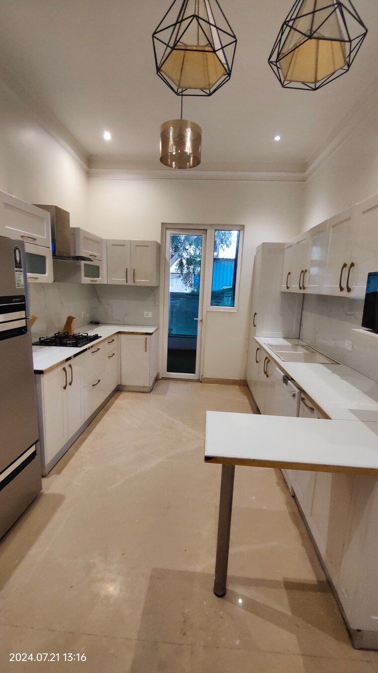 Kitchen, t-and-t-eutopia-phase-1 4 Bedroom 2295 Sq.Ft. Apartment In Siddharth Vihar Ghaziabad 8701610