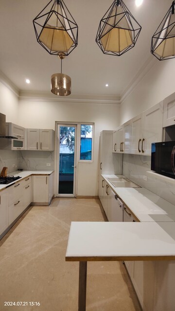 Kitchen in 4 BHK Apartment at T And T Eutopia Phase 1, Siddharth Vihar – for Sale