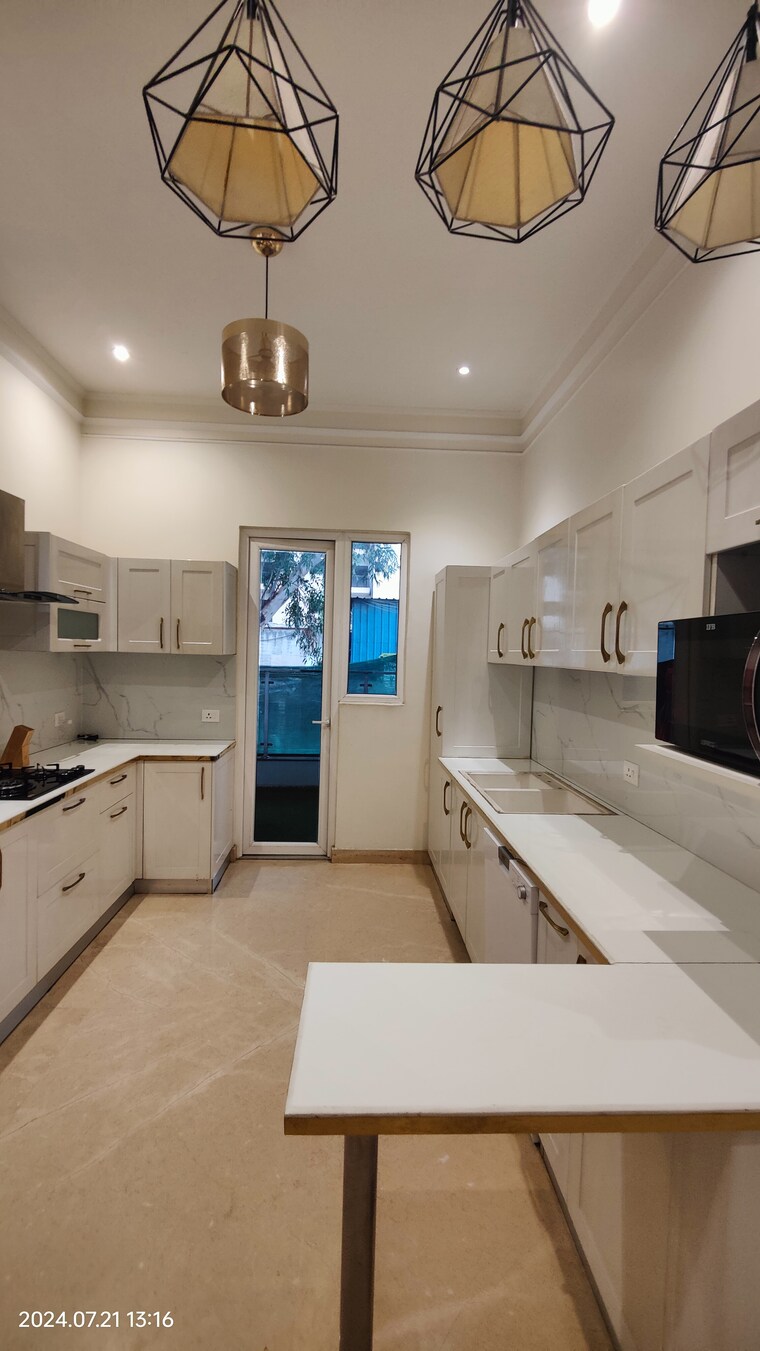 Kitchen, t-and-t-eutopia-phase-1 4 Bedroom 2295 Sq.Ft. Apartment In Siddharth Vihar Ghaziabad 8701610