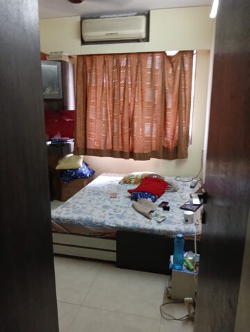 Bedroom in 1 BHK Apartment at Swastik Residency Phase II CHS Ltd, Pratha Pushp Society – for Rent
