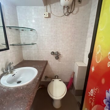 Bathroom in 1 BHK Apartment at Swastik Residency Phase II CHS Ltd, Pratha Pushp Society – for Rent