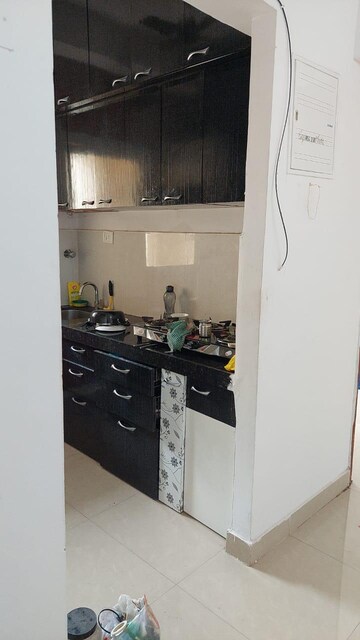 Kitchen in 2 BHK Apartment at Salasar Cosmos CHS, Mira Road – for Rent