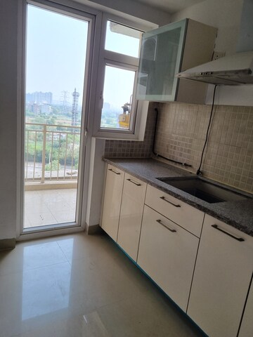 Kitchen in 3 BHK Apartment at Emaar Gurgaon Greens, Sector 102 – for Sale