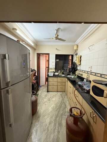 Kitchen in 3 BHK Apartment at Green Valley CHS, Wanwadi – for Rent