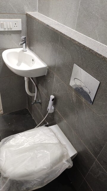 Bathroom in 3 BHK Apartment at Shree Balaji Agora Residency, Sughad – for Rent