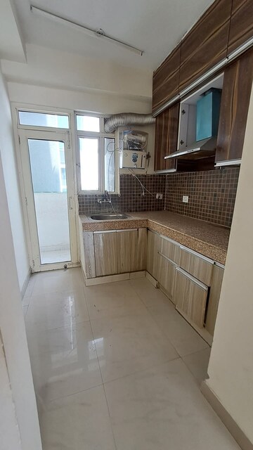 Kitchen in 2 BHK Apartment at Gaur City 2 - 12th Avenue, Sector 16c Greater Noida – for Rent