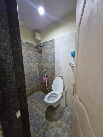 Bathroom in 2 BHK Apartment at Crystal Garden Estate CHS, Manpada – for Rent