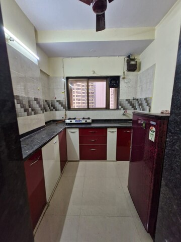 Kitchen in 2 BHK Apartment at Crystal Garden Estate CHS, Manpada – for Rent