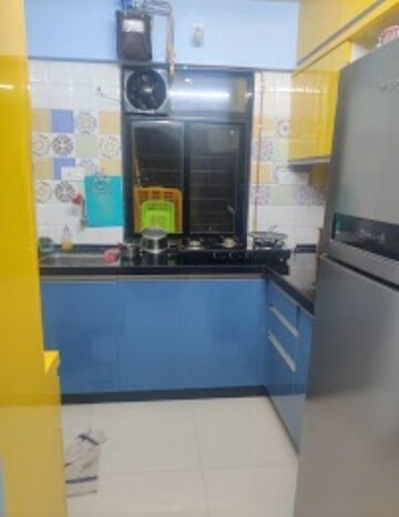 Kitchen in 1 BHK Apartment at Raunak Heights, Ghodbunder Road – for Sale
