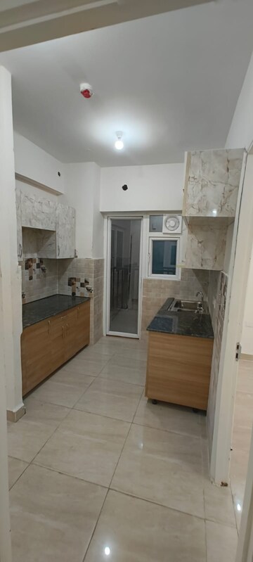 Kitchen in 2 BHK Apartment at Gaur City 2 - 14th Avenue, Sector 16c Greater Noida – for Rent