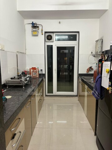 Kitchen in 2 BHK Apartment at Rustomjee Urbania Azziano, Majiwada – for Rent