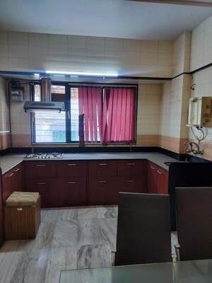 Kitchen in 2.5 BHK Apartment at Garden Avenue, Nerul Sector 21 – for Sale