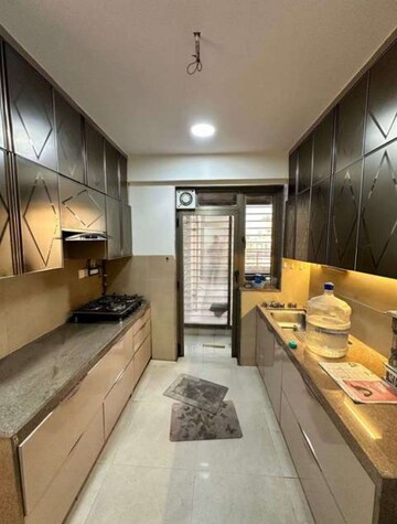 Kitchen in 2.5 BHK Apartment at T Bhimjyani Neelkanth Woods, Manpada – for Rent