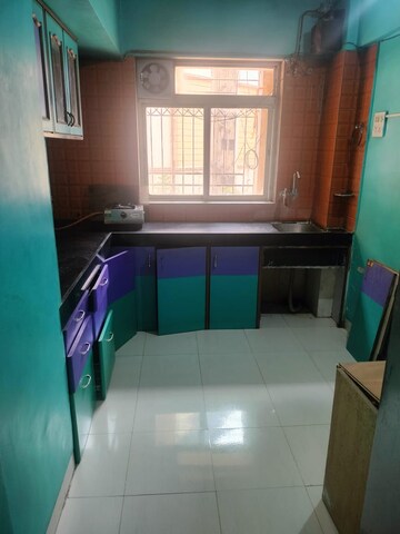 Kitchen in 1 BHK Apartment at Krishna Greenland Park Vastu Federation, Ghodbunder Road – for Rent
