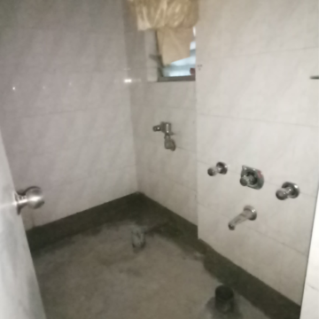 Bathroom in 2.5 BHK Apartment at Kalpa Taru Siddhachal III, Vasant Vihar – for Sale