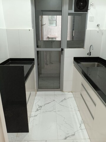 Kitchen in 1 BHK Apartment at MICL Aaradhya Parkwood, Mira Road – for Rent