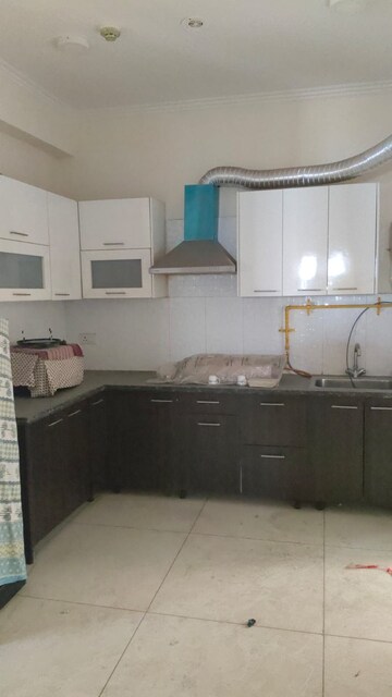 Kitchen in 4 BHK Apartment at Mahagun Mywoods, Sector 16c Greater Noida – for Rent