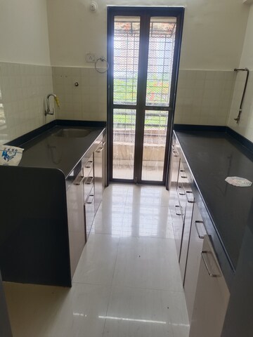 Kitchen in 3 BHK Apartment at Hubtown Greenwoods, Vartak Nagar – for Sale