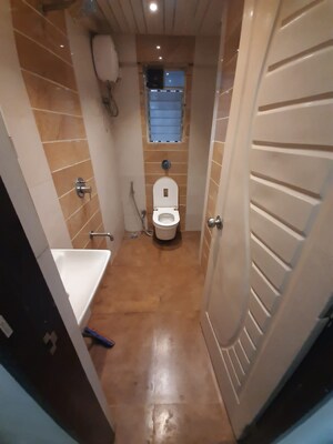 Bathroom in 1 BHK Apartment at Mohini Castle, Khar West – for Sale