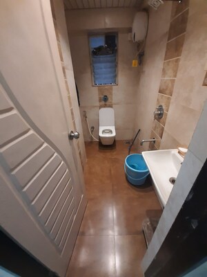 Bathroom in 1 BHK Apartment at Mohini Castle, Khar West – for Sale