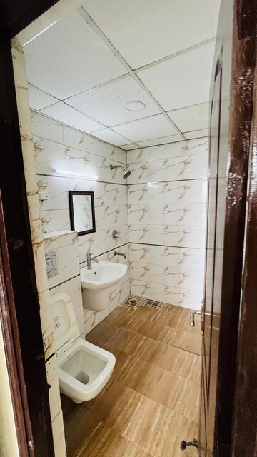 Bathroom in 2 BHK Apartment at Gaur Yamuna City Gaur Suites, Gaur Yamuna City – for Rent