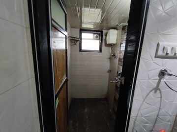 Bathroom in 1 BHK Apartment at Mandakini CHS, Dahisar East – for Rent