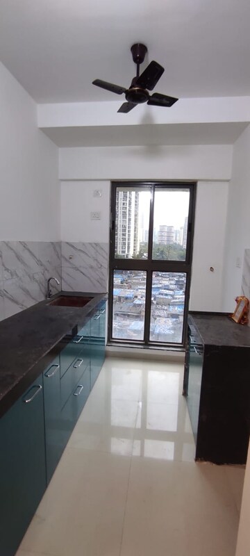 Kitchen in 1 BHK Apartment at Teenmurti Summit, Borivali East – for Rent