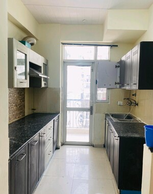 Kitchen in 2 BHK Apartment at Prateek Wisteria, Sector 77 – for Sale