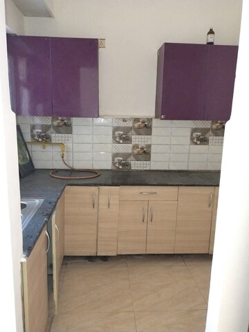 Kitchen in 2 BHK Apartment at Town Park White Orchid, Sector 16c Greater Noida – for Rent