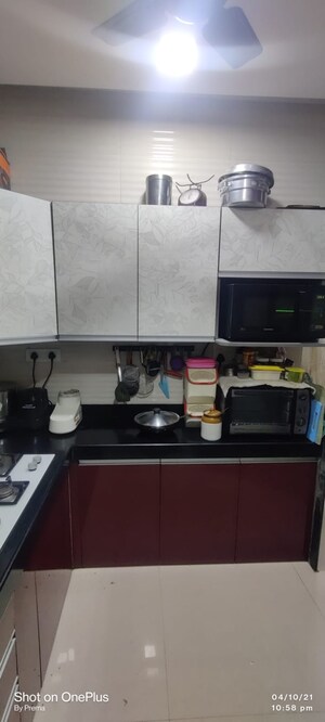 Kitchen in 2 BHK Apartment at Cosmos Jewels Solitaire, Ghodbunder Road – for Sale