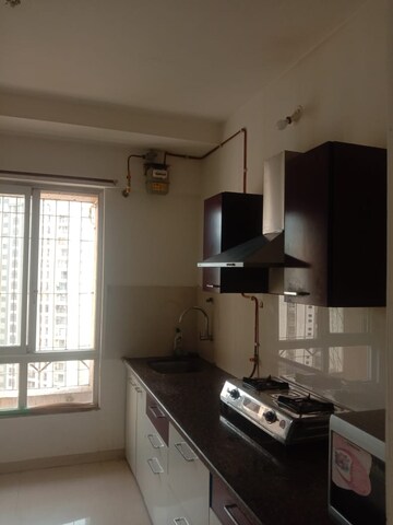Kitchen in 2 BHK Apartment at Dedhia Platinum Lawns, Ghodbunder Road – for Rent