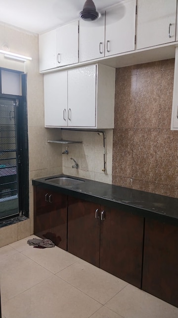Kitchen in 2 BHK Apartment at Krishna Residency Kopar Khairane, Kopar Khairane – for Sale