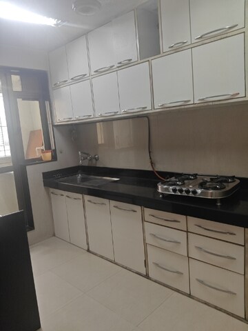 Kitchen in 2.5 BHK Apartment at Raheja Acropolis, Deonar – for Sale