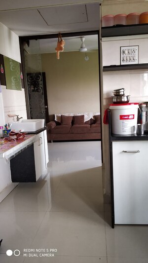 Living Room in 1.5 BHK Apartment at Vip Road Vesu – for Sale