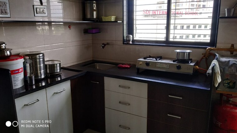 Kitchen, vip road vesu 1.5 Bedroom 700 Sq.Ft. Apartment In Vip Road Vesu Surat 8735317